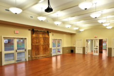 The Landrum Railroad Depot community room with the original freight doors on display.