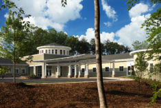A photograph of the Smith Phayer Hospice House showing the main entrance and chapel to the right.