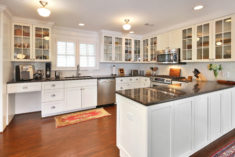 View of kitchen with new cabinet work and appliances.